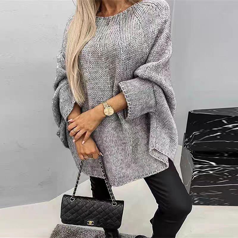 Trendig damtröja: oversized cape med batwing-ärmar. Bekväm och varm för höst- och vintermode, perfekt att lager-på-lager.