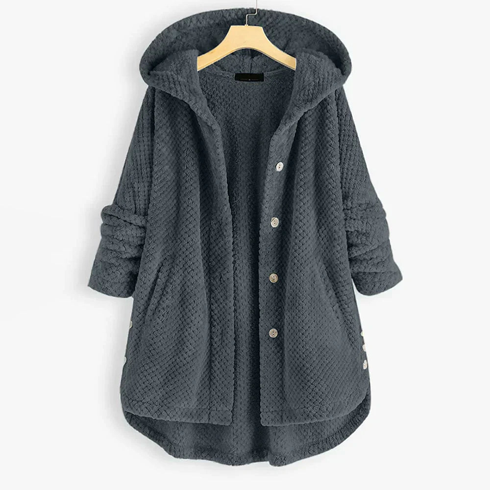 Trendig oversized huvjacka i dammode, ger avslappnad stil och värme under hösten.