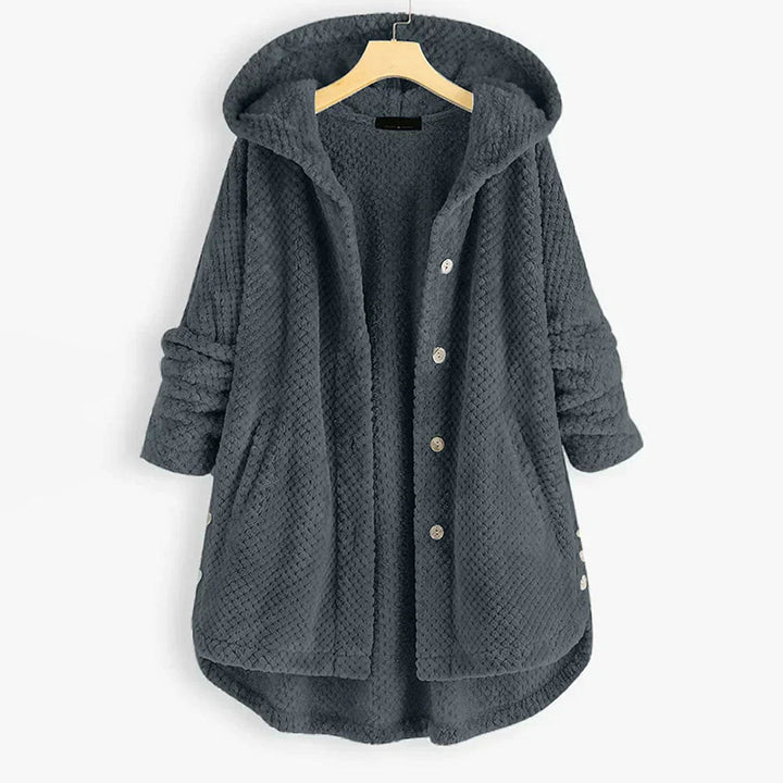 Trendig oversized huvjacka i dammode, ger avslappnad stil och värme under hösten.