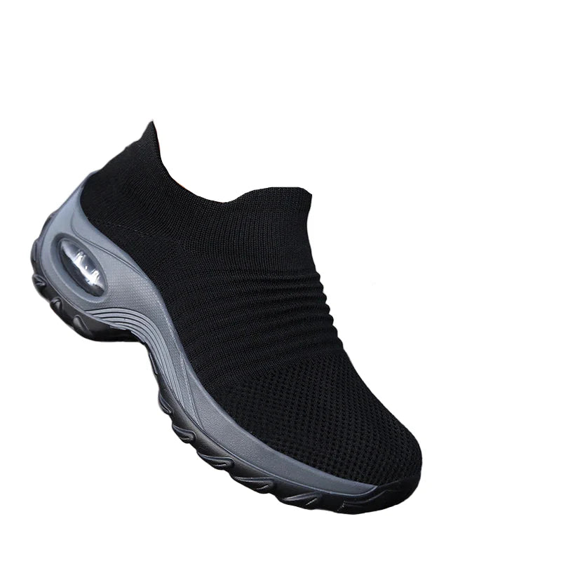 Kvinnors sneakers med tjock dämpande sula och luftkudde för optimal komfort.
