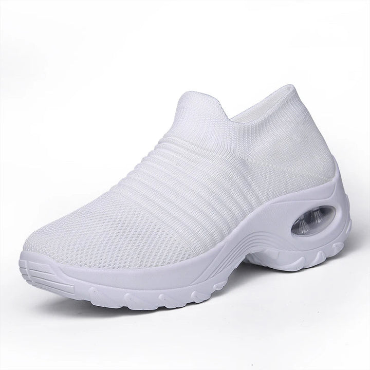 Sportiga dam sneakers med stötdämpande luftkudde och tjock, bekväm sula.