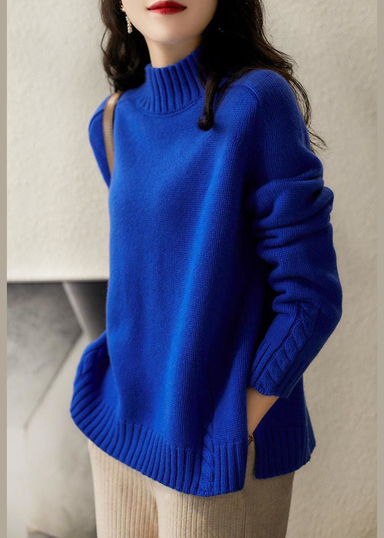 Trendig vintage blå stickad damtröja med unik öppen sida, erbjuder en modern och avslappnad loose fit.
