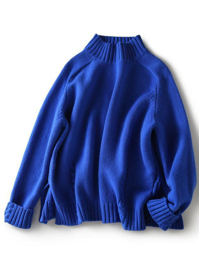 Kvinnlig vintage blå stickad tröja med öppen sida och lös passform, perfekt för en bekväm och stilren höstlook.