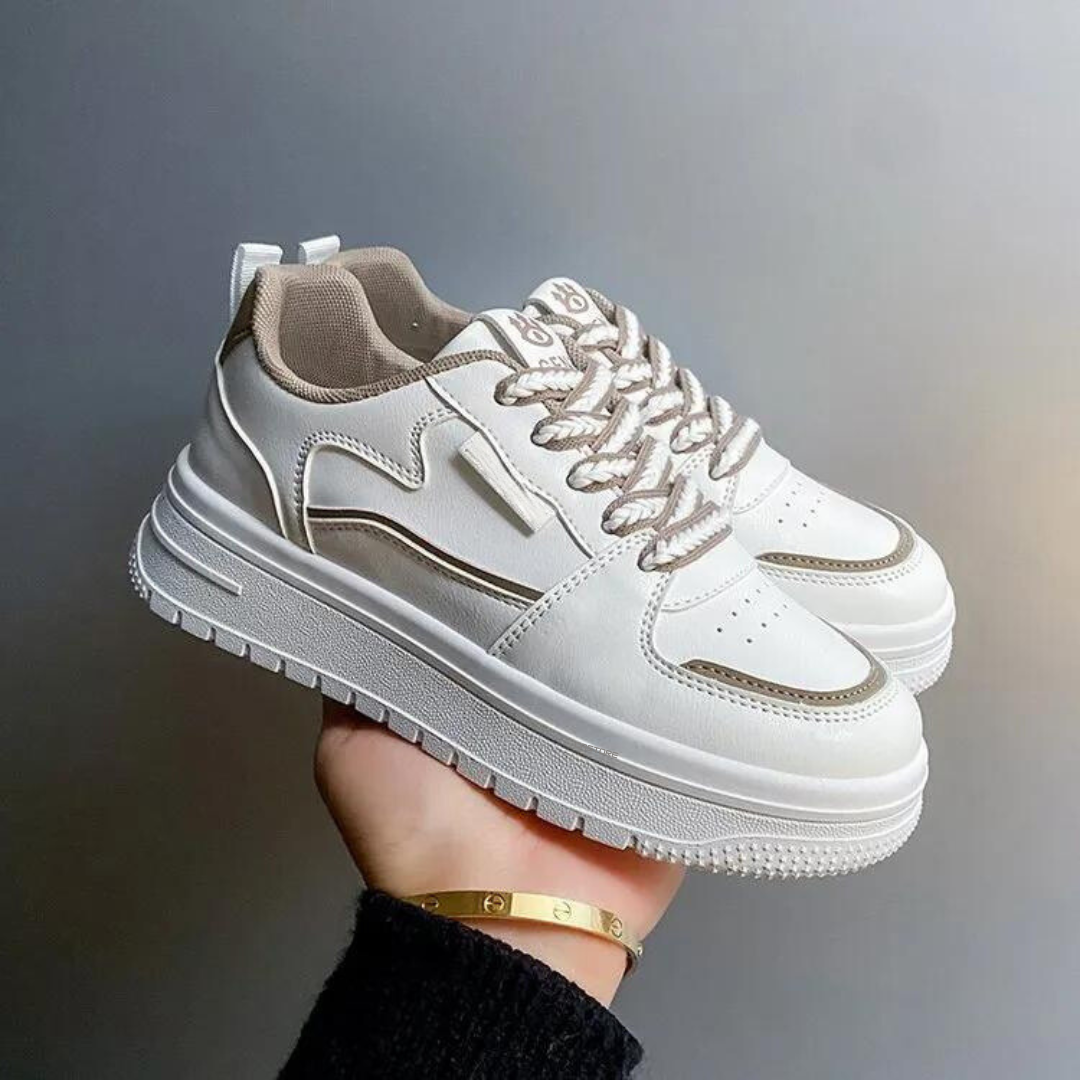 Kvinnors modiga chunky platåskor. Trendiga sneakers med tjock sula och snörning för en modern fritidslook.