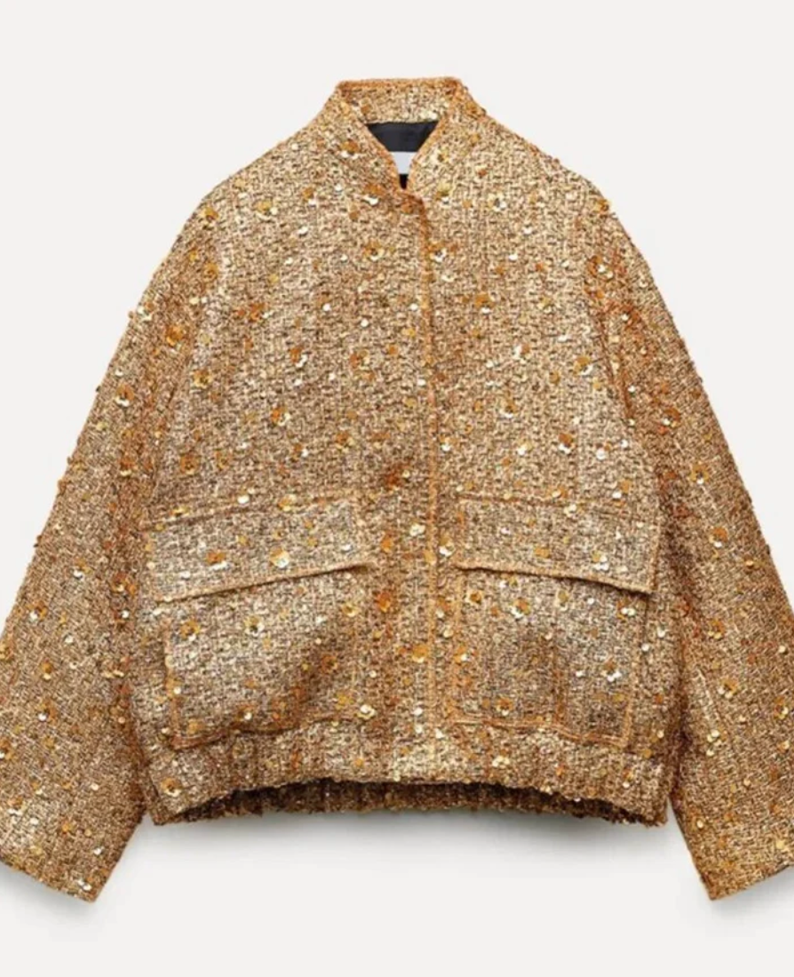Modeinriktad kvinnors paljettjacka, elegant design för en stilfull festlook.