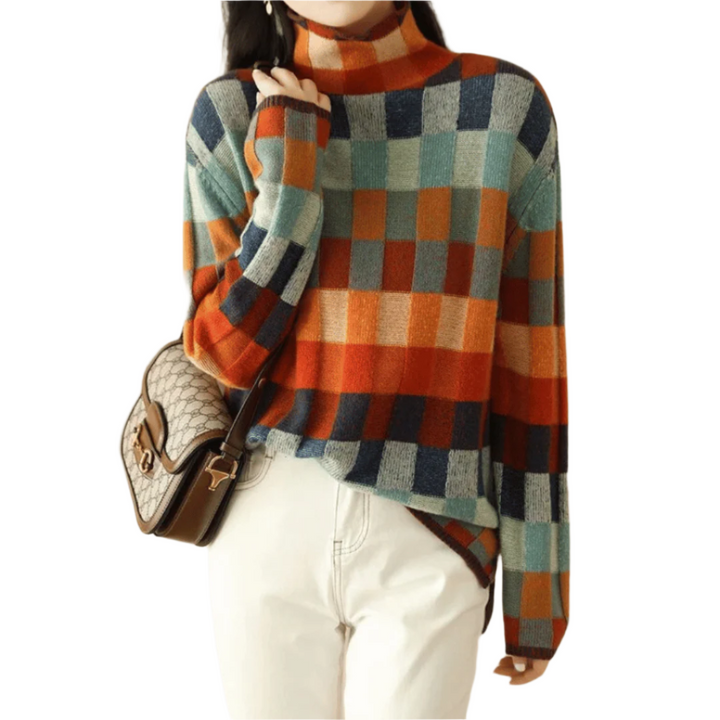 Kvinnors turtleneck tröja med unik patchwork design. Hög krage och bekväm stil för dammode.