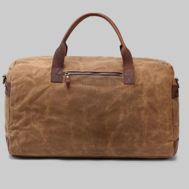 Snygg vintage duffelväska för kvinnor i tvåfärgad design, idealisk som weekendväska.