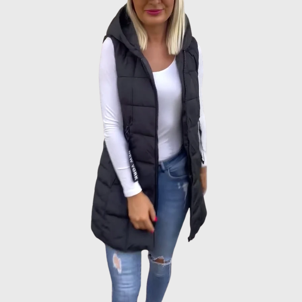 Varm vadderad damkappa utan ärmar. Trendig streetwear-design med dragkedja för höst & vinter.