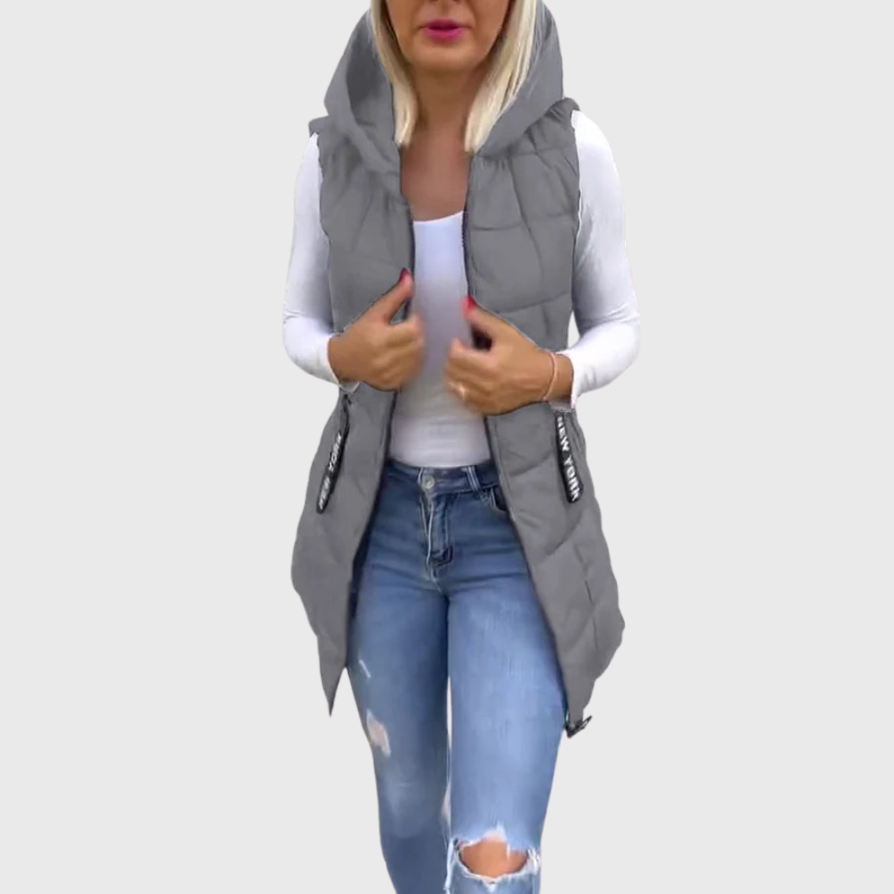 Kvinnors höst/vinter kappa: Ärmlös, vadderad och med huva. Perfekt för en avslappnad streetwear-look.