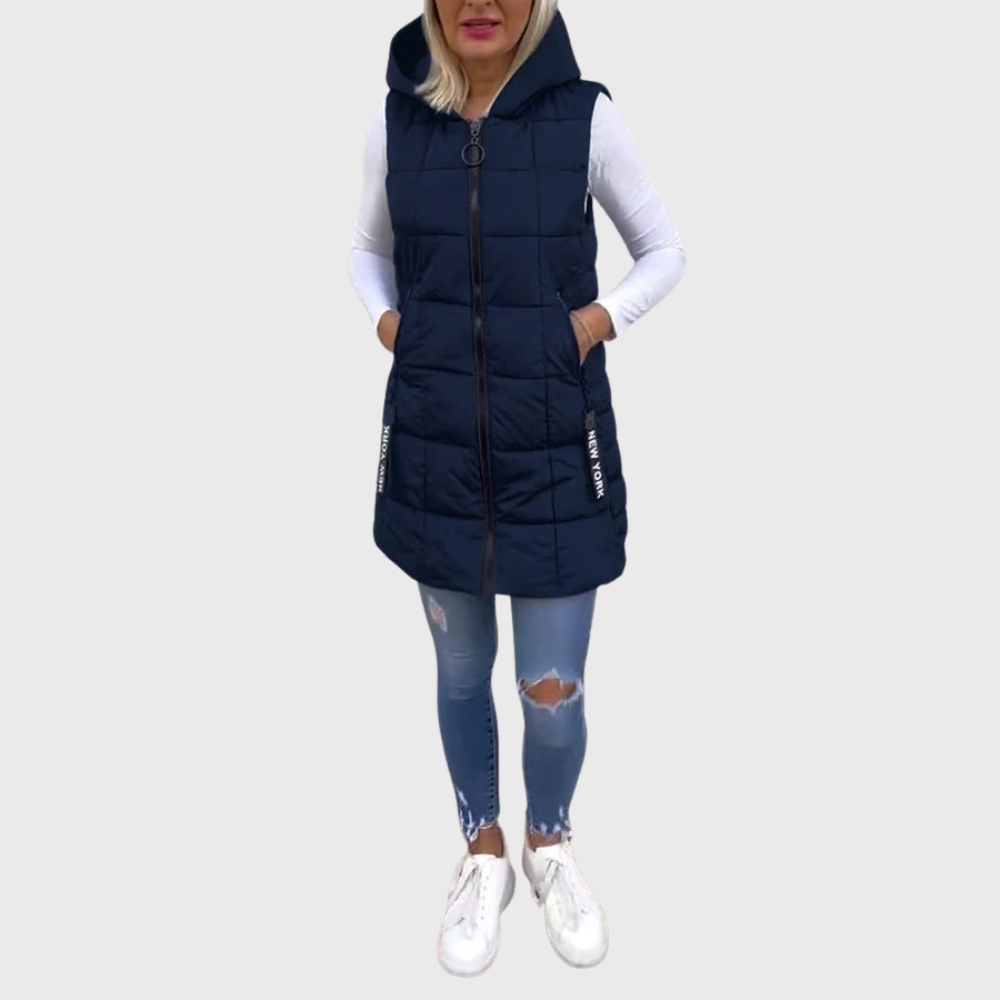 Mångsidig ärmlös ytterkläder för kvinnor. Vadderad kappa i urban streetwear-stil, bra för lager.
