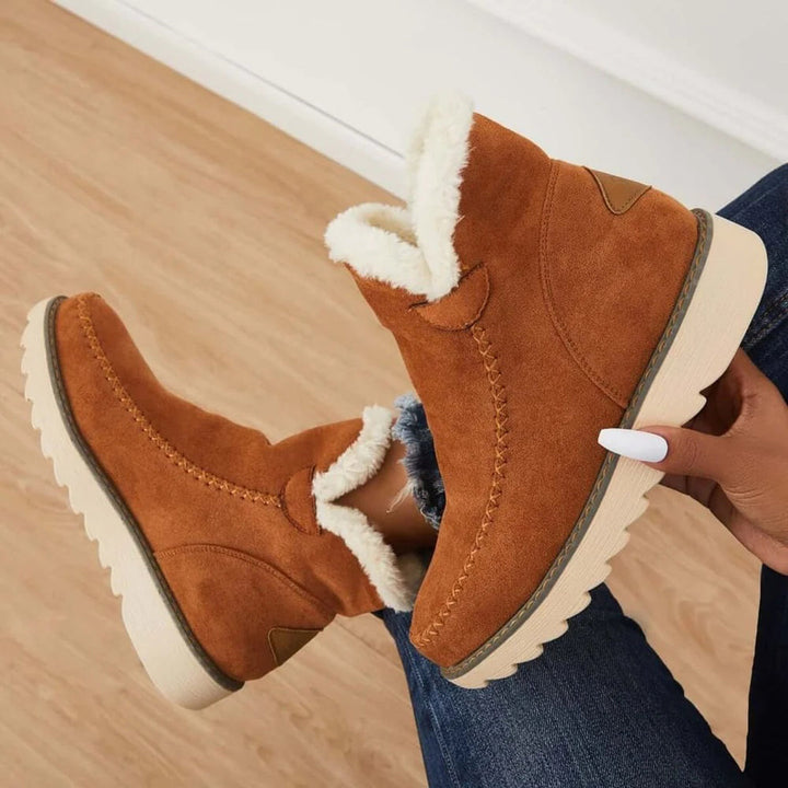 Kvinnors beige vinterstövlar med antislip-design, erbjuder överlägsen fotsäkerhet och mysig värme.