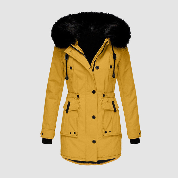 Stilren kvinnors parkas i elegant design med fuskpäls. Varm och bekväm damjacka för höst och vinter.