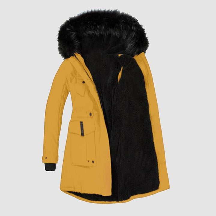 Kvinnors parkas med justerbar midja för smickrande passform. Varm vinterjacka med huva och fuskpäls.