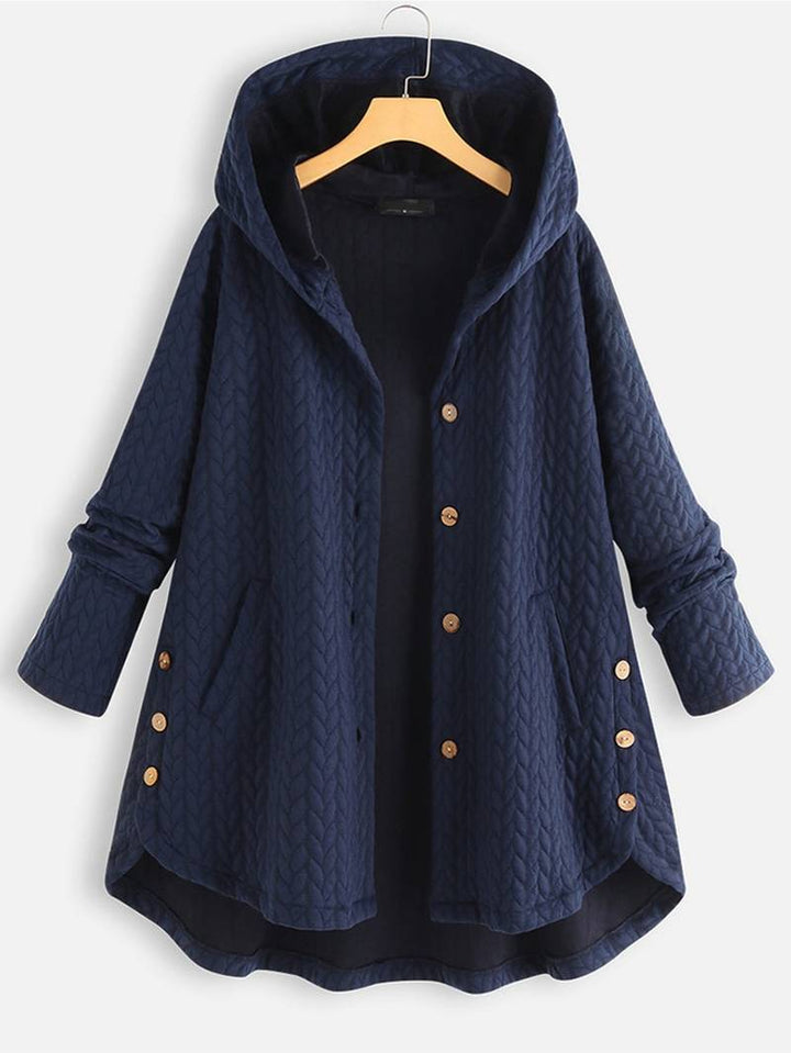 Kvinnors vinterjacka i beige, varm och fodrad för vintern. Stilren design, perfekt ytterplagg för kyla.