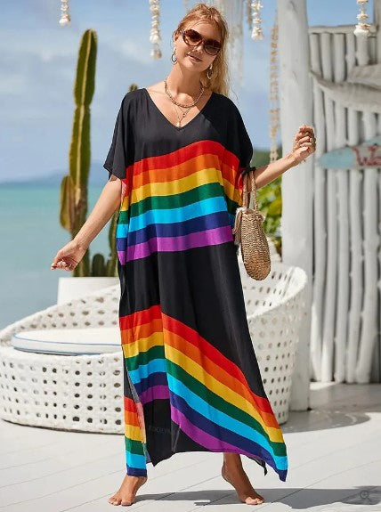 Mönstrad lång boho klänning med regnbågsmotiv. Mångsidig sommarklänning för både avslappnade dagar och fest.