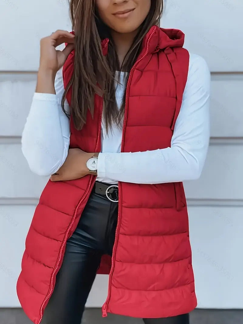 Trendig oversized lång väst för kvinnor. Quiltad huvvärmare för en modern höst- & vinterlook.