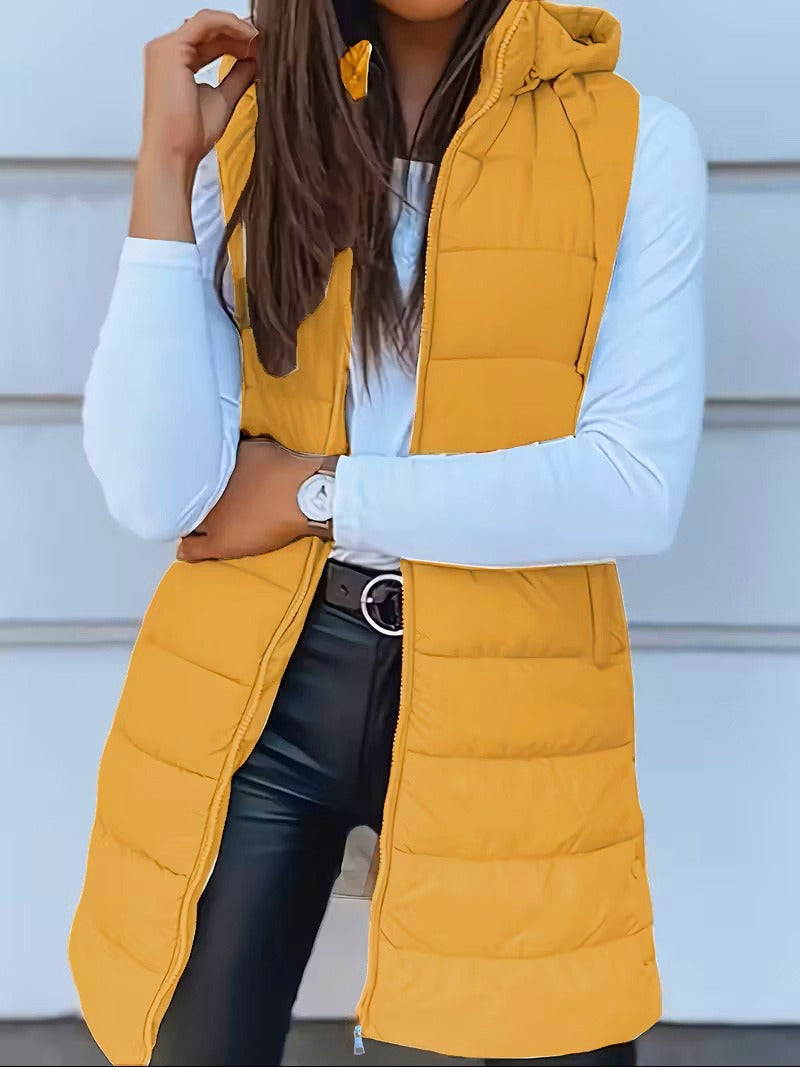 Mångsidig lång väst med huva för kvinnor. Varm, oversized & quiltad, perfekt för höst- och vintergarderoben.