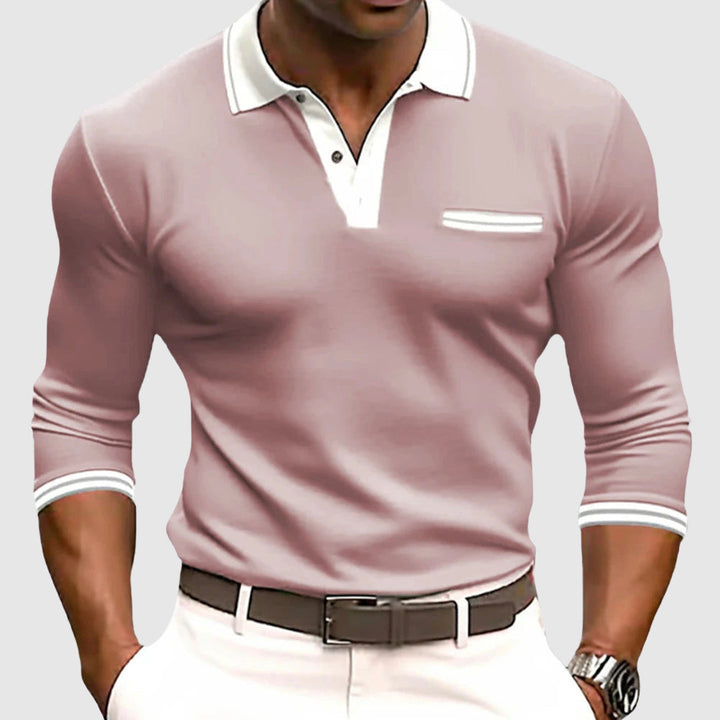 Modern herrtröja med bröstficka, långa ärmar och eleganta kontrastdetaljer. Mångsidig för casual och golf.