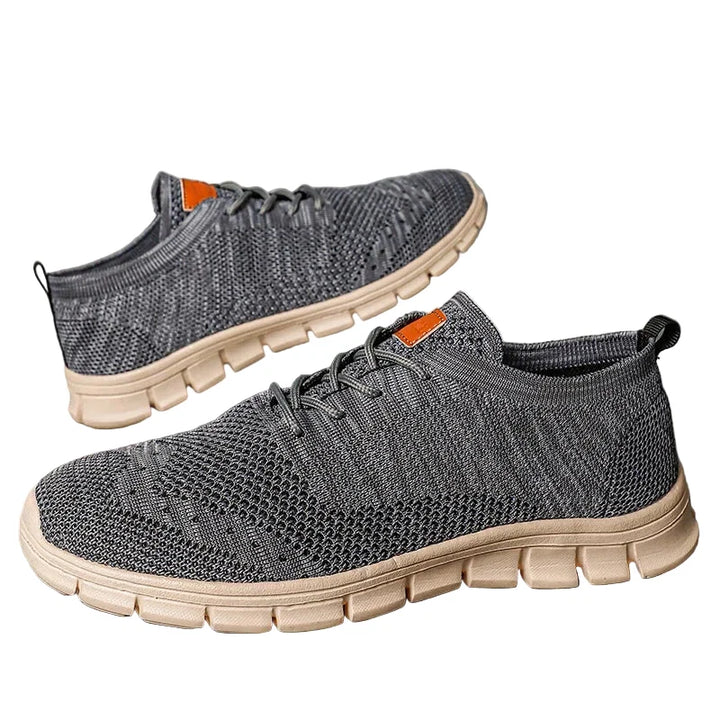 Lätta herr sneakers för vardagsbruk, komfort och stil. Grå/svart design, perfekt för casual look.