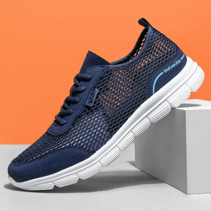 Grå herr löparskor med andningsbart ovandel, idealiska för löpning. Bekväma sneakers för aktiv livsstil.