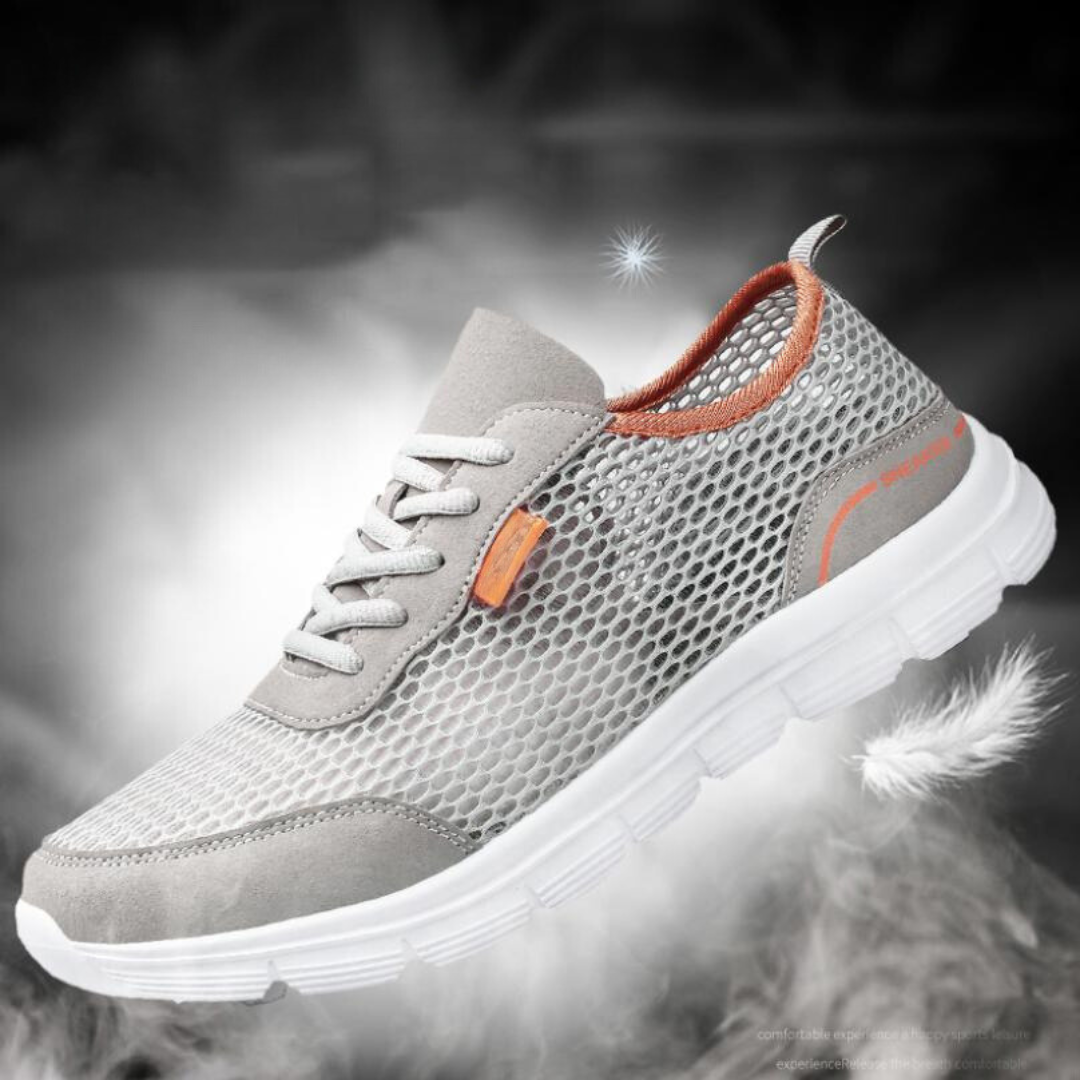 Lättviktssula på grå herr löparskor för bra grepp och komfort. Andningsbara sneakers, idealiska för träning.