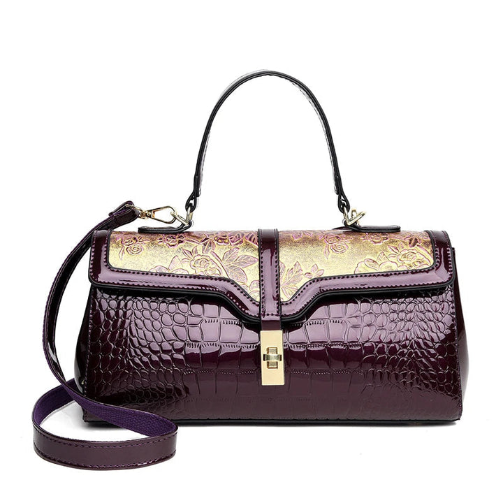 Närbild: Blommig design på lyxig damväska. Elegant toteväska med detaljer, fashion accessoar.