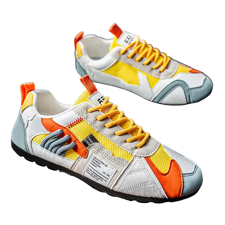 Mäns färgblock sneakers. Moderna herrskor för vardagsstil. Mångfärgade, bekväma casualskor med snörning.