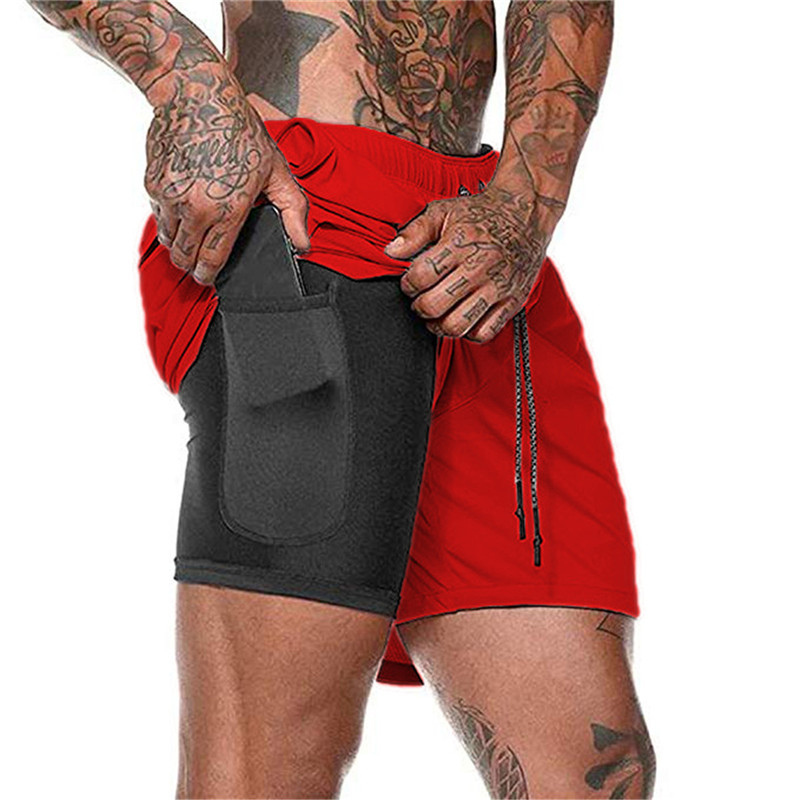 Stilrena träningsshorts för män med dubbellager och fickor, designade för ultimat komfort och prestanda på stranden.