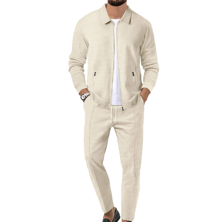 Mäns modern träningsoverall med zip-jacka och matchande byxor. Bekväma sportkläder för herr.