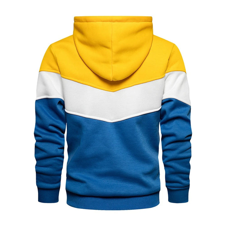 Man i rörelse: casual herr patchwork hoodie. Varm och bekväm streetwear för en aktiv vardag.