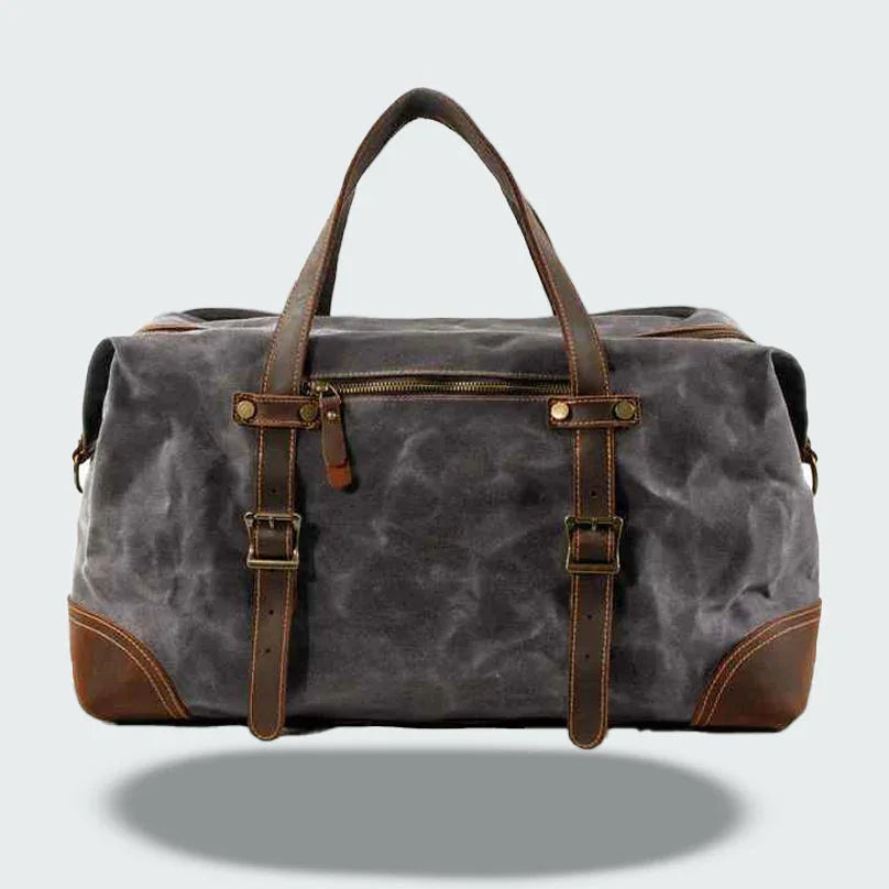 Elegant herrresväska, vintage canvas med bruna läderremmar och mässingsspännen.