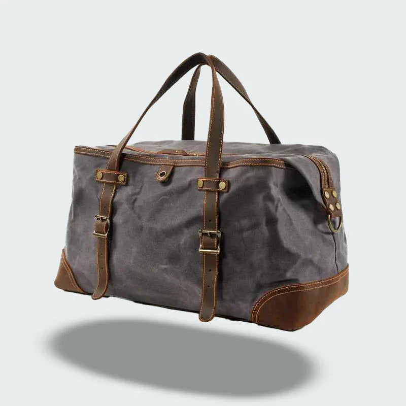 Rymlig herrresväska i vintage design, robust canvas/läder för weekend/affärer.