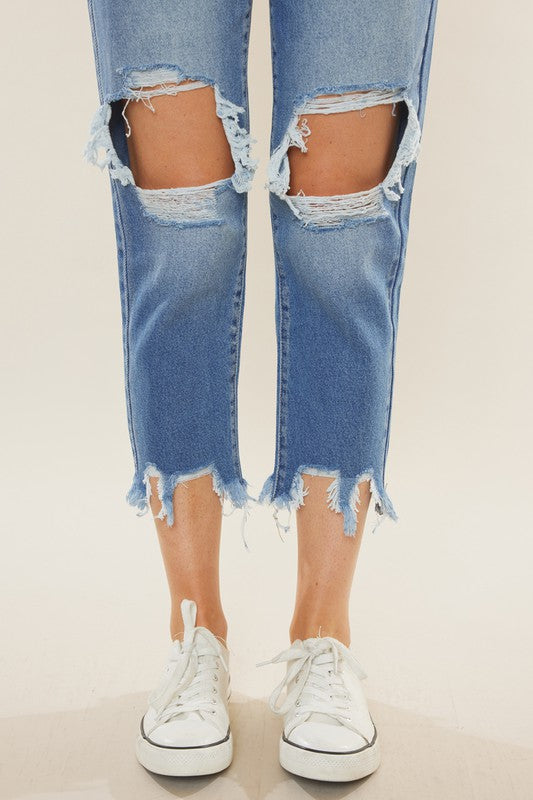 Kvinnors mörkblå mamma jeans med hög midja, tillverkade av slitstark denim för en tidlös look.