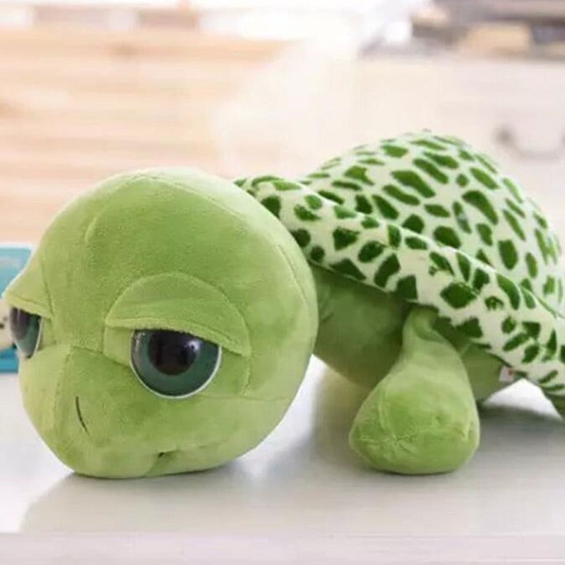 Unisex sköldpadds mjukdjur med stora, glittriga ögon, en mysig present och barnleksak.
