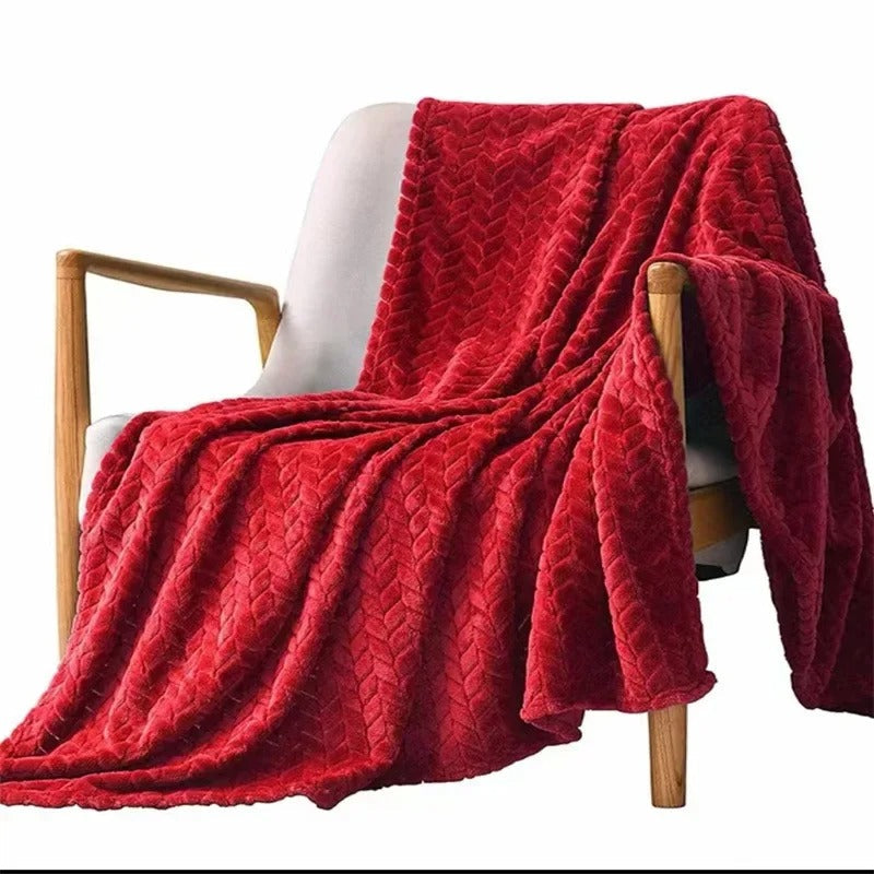 Elegant korallfilt för heminredning, mjuk och inbjudande för avkoppling och komfort.