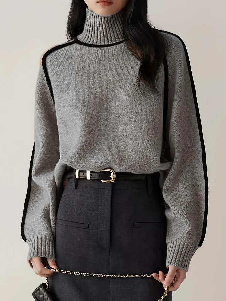 Modern dam turtleneck tröja, stickad i mjukt garn. Varm och elegant för alla tillfällen, vintermode.