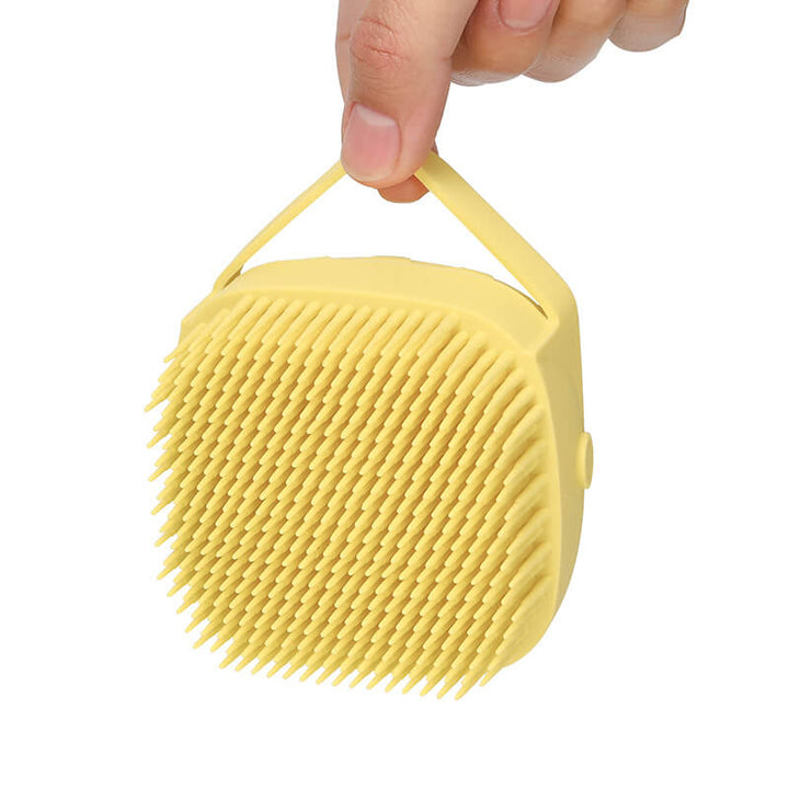 Skonsam kattborste i silikon med dispenser. Perfekt för bad & pälsmassage.