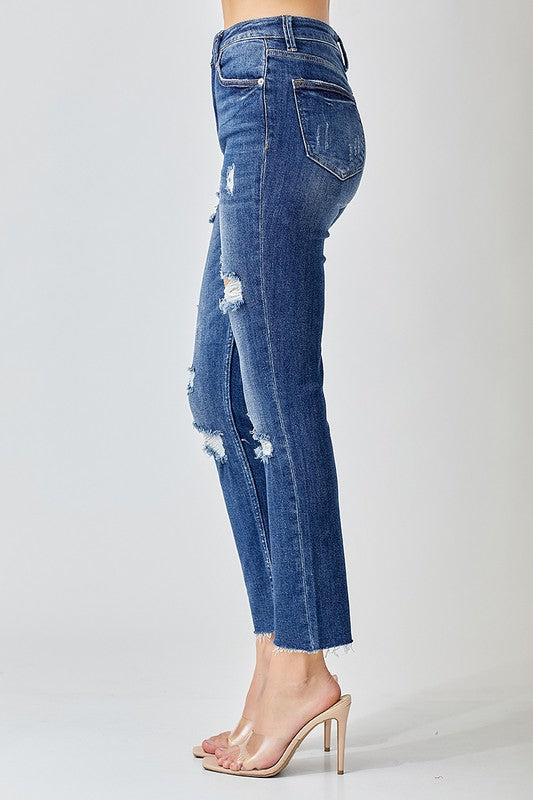 Bakifrån visning av stretchiga högmidjade skinny jeans för dam i mörk tvätt, perfekt för casual mode.