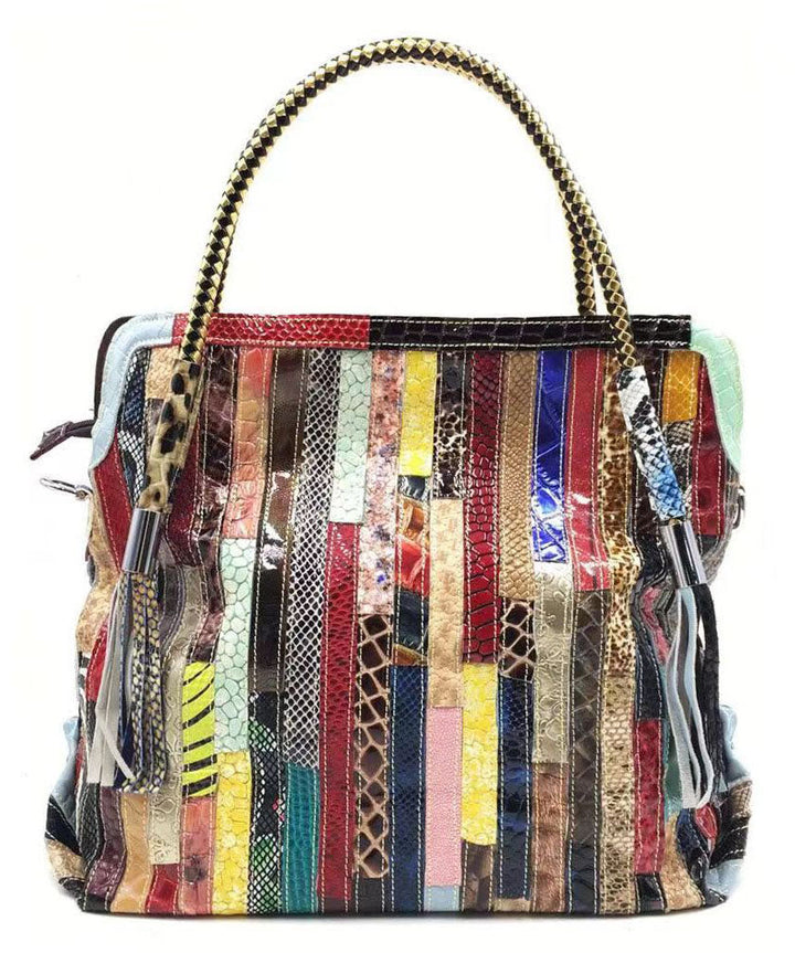 Stilfull damväska med ormskinnsmönster patchwork. Unik design i tote-modell, ideal för organiserad vardag.
