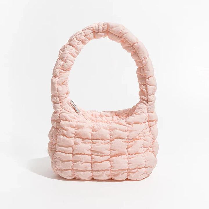 Lättvikts axelväska i urban miljö, perfekt unisex vardagsväska med modern design.