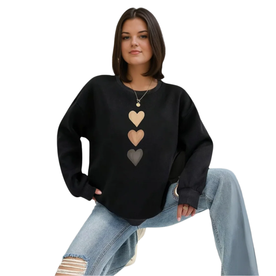 Mysig dam pullover med trendigt hjärtmotiv. Perfekt vardagströja för en bekväm stil.
