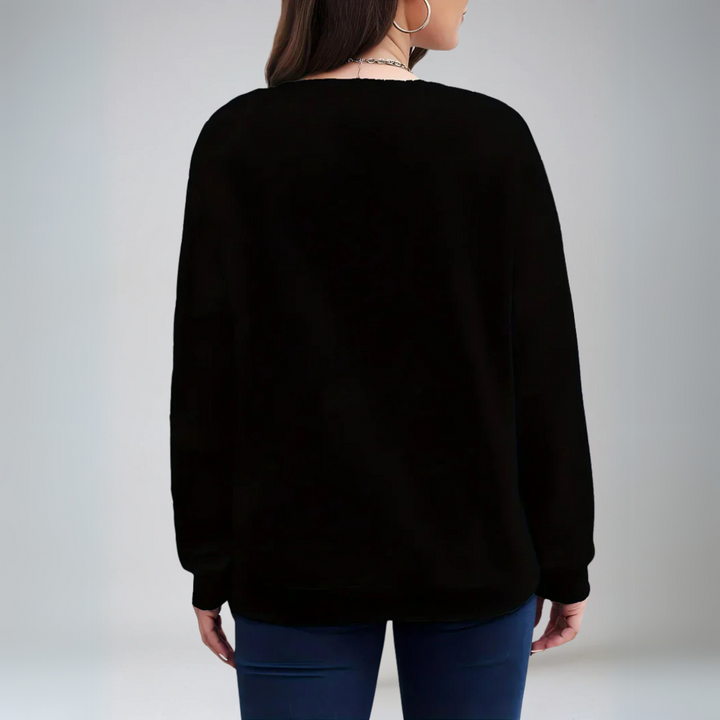 Stilren damtröja med hjärtmotiv. En avslappnad och bekväm pullover för kvinnomode.