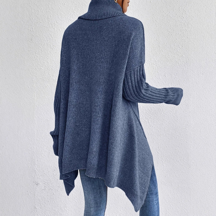 Varm & stickad damtröja med turtleneck, mysig design för kalla vinterdagar. Avslappnad passform.