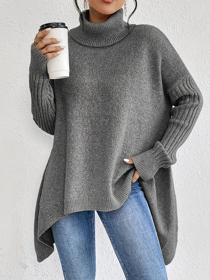 Damkläder: Trendig turtlenecktröja i mjukt material, perfekt för en varm och elegant vinterstil.