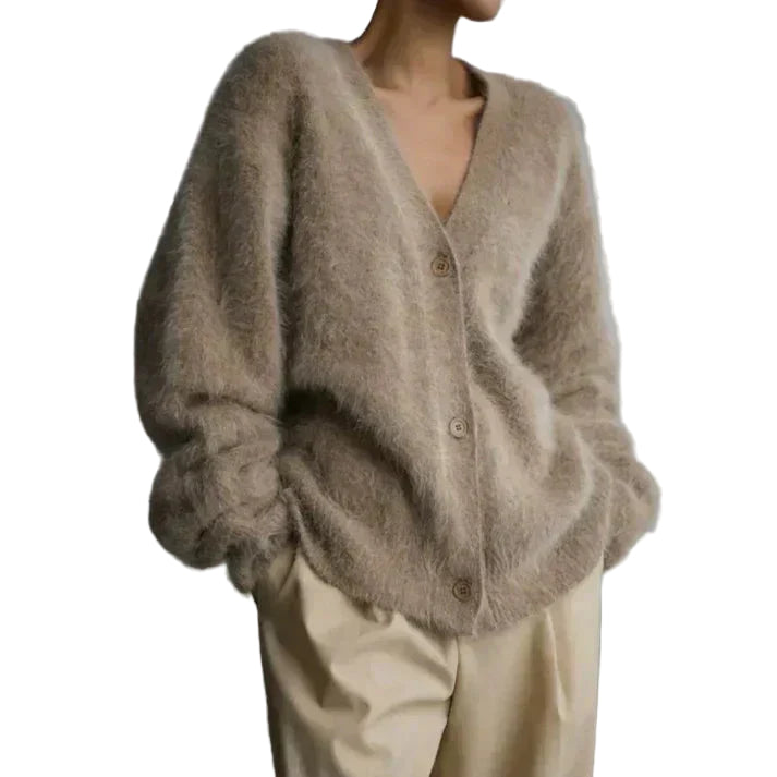 Mysig stickad damväst med knappar för höst/vinter. Varm, bekväm och elegant höstmode.