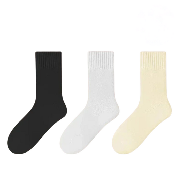 Vikta, varma damvinterstrumpor i svart, vitt och gult. Ett prisvärt 3-pack mysiga strumpor.