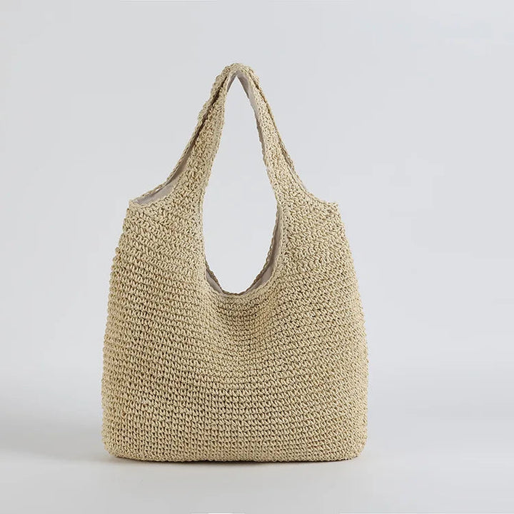 Elegant beige solkysst damväska, stor toteväska för strand och fritid.