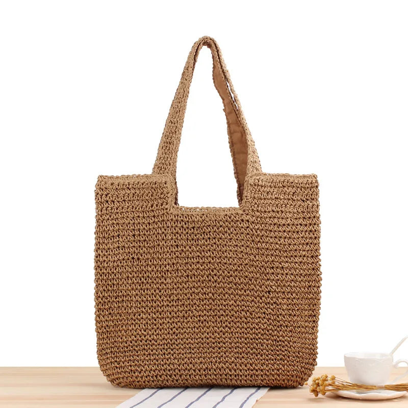Casual damväska, solkysst tote i beige/brun, utmärkt som strand- eller shoppingväska.