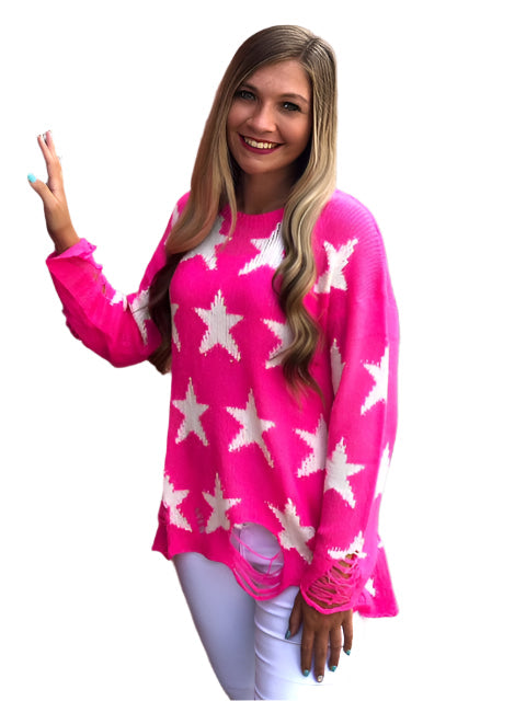 Neonrosa långärmad damtröja med rund hals och stjärnmönster, perfekt för avslappnad höstmode.