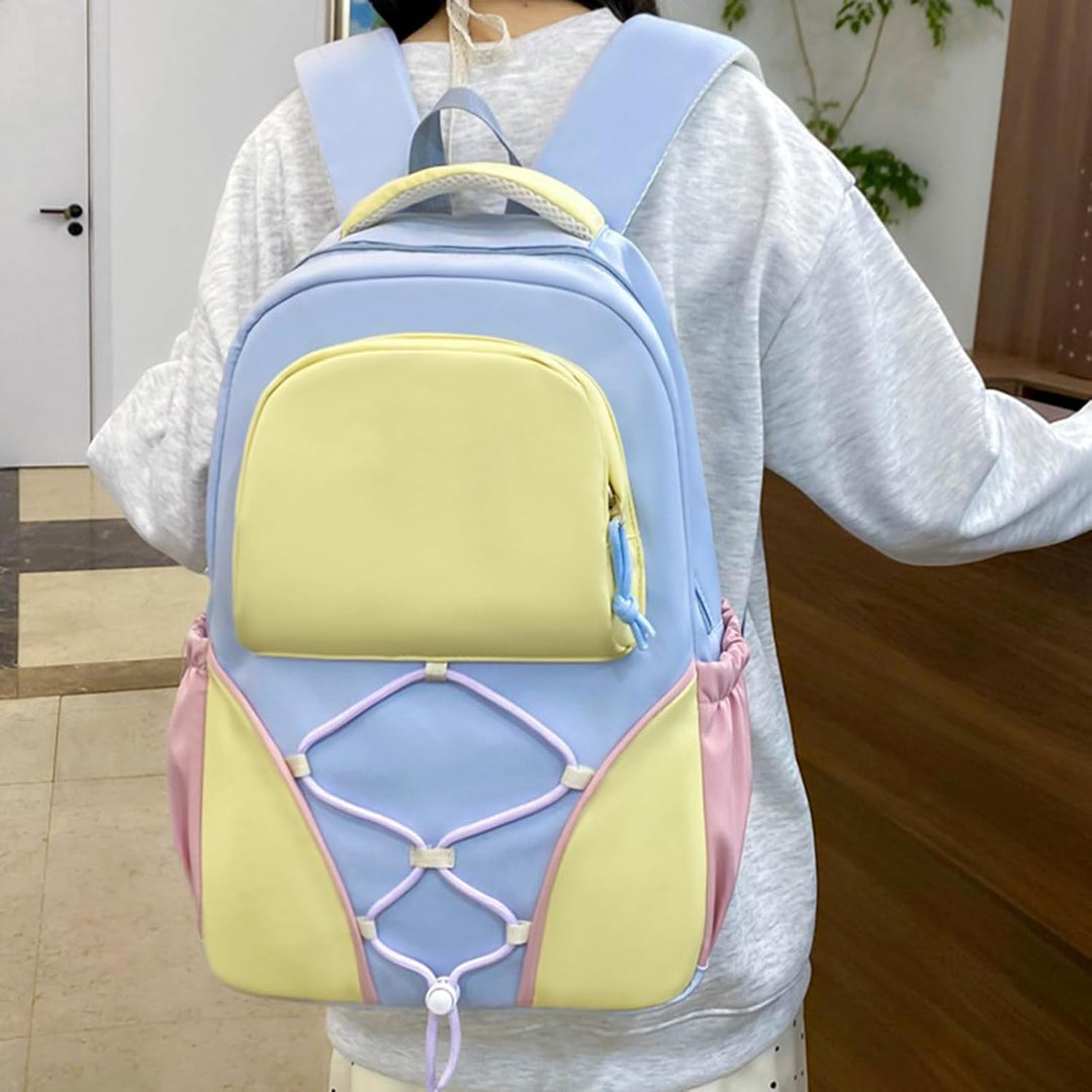 Stor Nivora skolryggsäck i lila/blå, vattentät nylon/polyester, rymlig för alla skolböcker.